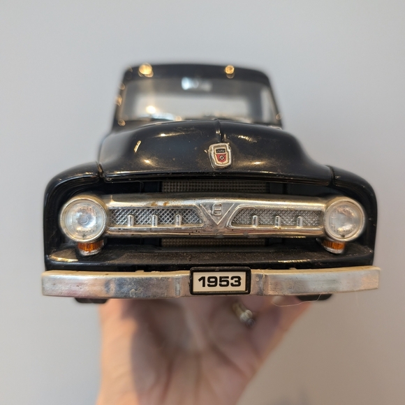 Classic Black Toy Truck with Red Wheels - Picture 3 of 11
